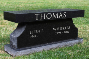Faithful Friends garden black granite cremation bench for humans and pets.